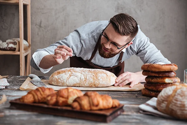 baker applying finishing touches