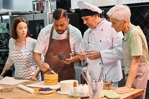 chefs working on a cake