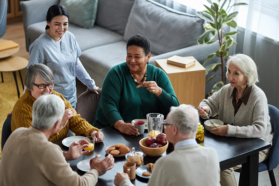 senior people sitting at table together